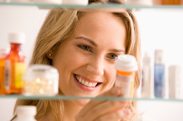 Woman Looking in Medicine Cabinet-Credit-iStock- Woman Looking in Medicine Cabinet