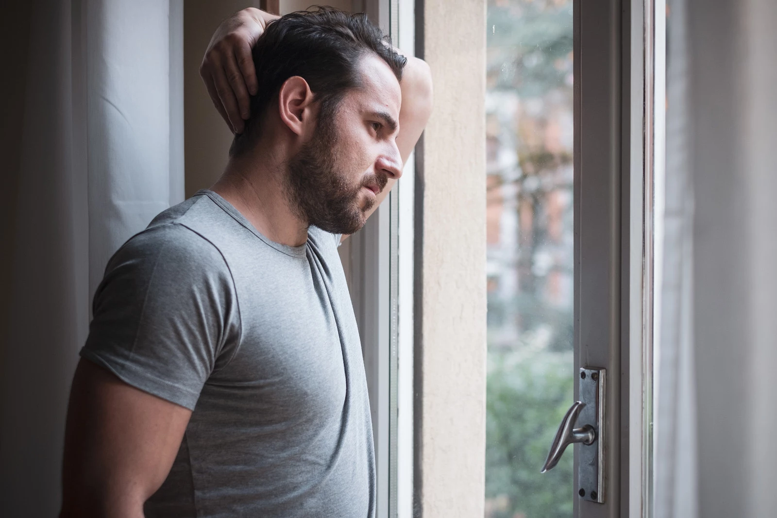 Man suffering and feeling alone at home